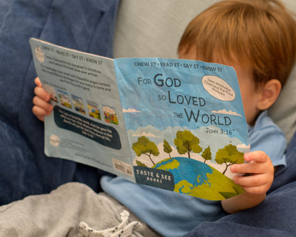 Child reading For God so loved the World