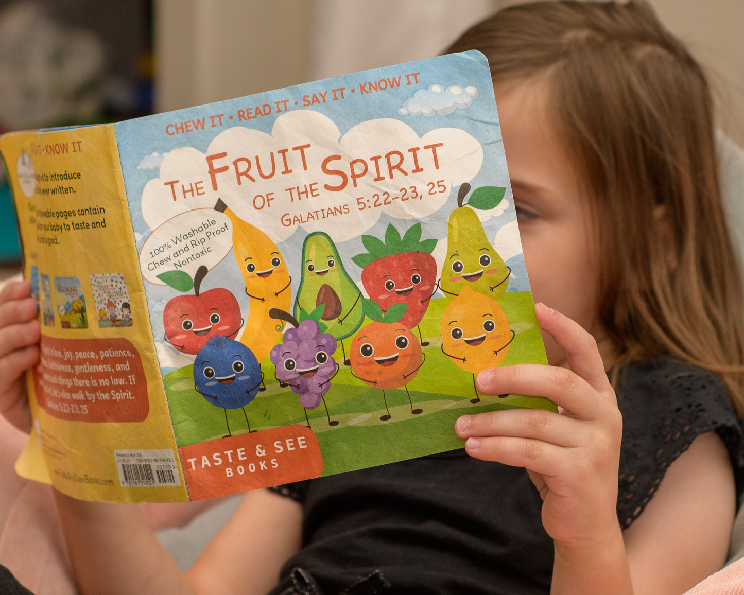 Child reading The Fruit of the Spirit